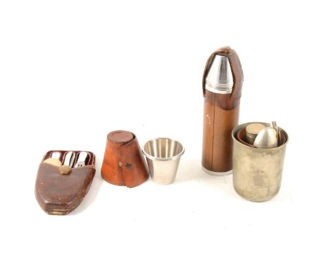 A stainless steel hip flask with four stirrup cups, in leather holder, a set of four stirrup cups in a leather holder, two ca