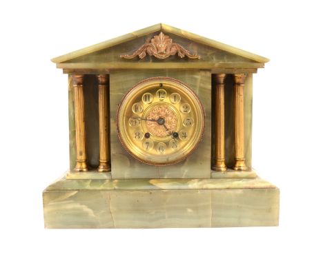 An Edwardian onyx mantel clock, the case of architectural form, circular dial, cylinder movement striking on a gong, 28cm, wi