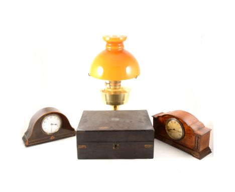 An Edwardian mantel clock, French cylinder movement; a walnut cased mantel clock, Swiss cylinder movement; a brass oil lamp, 