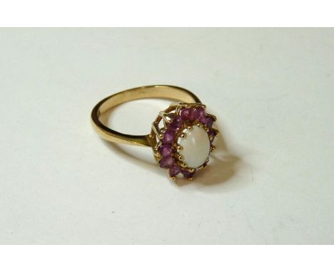 A 9ct gold opal and ruby cluster ring