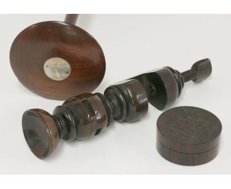 Three treen items, a George III wig stand with applied mother-of-pearl roundel, 37cm high, an incomplete rosewood swift, and 