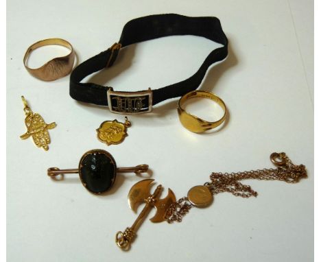 An Edwardian diamond set initial 'M' slide, with enamel border, a scarab bar brooch, three gold charms, and two gold rings
