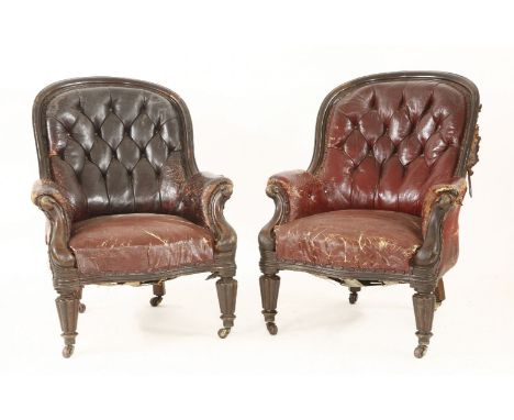 A pair of William IV mahogany library armchairs, distressed red leather, labelled G M & H J Story, Cabinet Makers, 53 London 