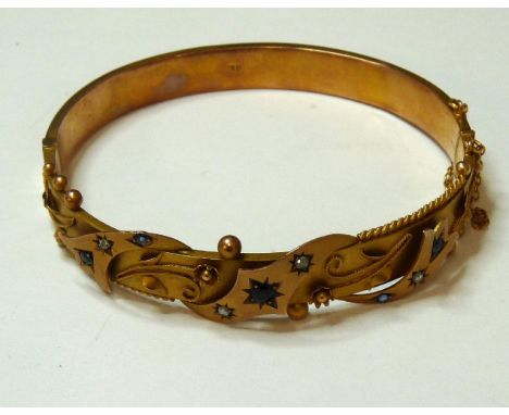 A 9ct gold garnet topped doublet, sapphire and diamond bangle, Chester 1911