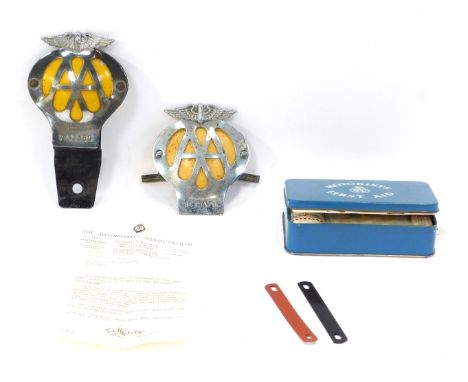 Two AA car badges, OM93189, 8C18476, and a motorist's RAC First Aid tin,  boxed. (3)