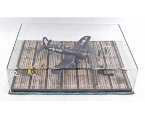 A c1:48 scale diorama of a Corsair F4V fighter plane, perspex cased.