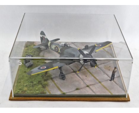 A 1:32 scale diorama of a Hawker Tempus Fighter Mark 5 fighter plane, in a perspex case.
