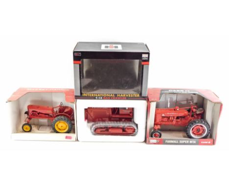 Ertl and SpecCast die-cast tractors, comprising a Farmall Super MTA tractor, Massey Harris tractor, and a International harve