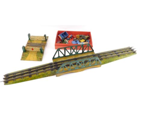 Hornby Series tin plate O gauge accessories, including a suspension bridge, level crossing, track extensions, figures, track 