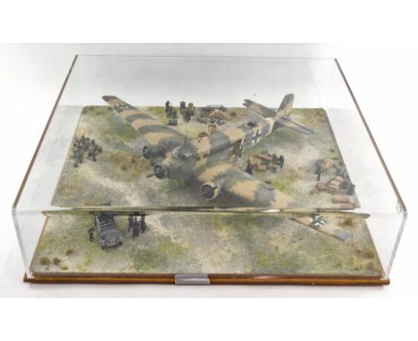 A 1:32 scale diorama of a Junkers JU52 German WW2 transport plane, in a perspex case. 