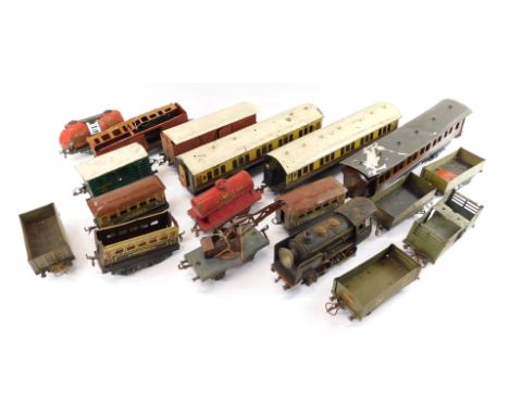 Bassett Lowke and Hornby tin plate O gauge rolling stock, including GWR chocolate and cream coaches, five plank wagons, tanke