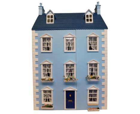 A Georgian style doll's house, four storey with front opening to reveal seven rooms, electric lighting, together with thirtee