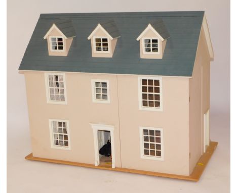 A Victorian style two storey doll's house, with front opening revealing seven rooms, electric lighting, together with furnitu