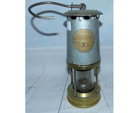 A miners' lamp by The Protector Lamp & Lighting Co Ltd