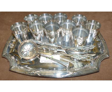 A pair of hallmarked silver butter knives; a silver knife and fork and sifter spoon; a set of 6 tot measures stamped 'Metal A
