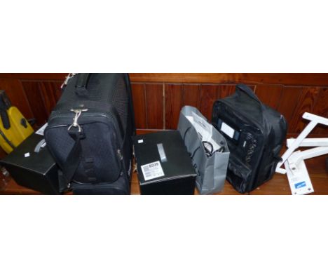 A karaoke machine; a bag; 2 wall lights; a TV bracket