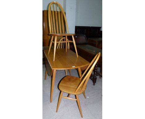 An Ercol light elm drop leaf dining table with 3 hoop back chairs