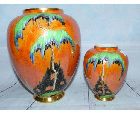 A 1930's Carlton baluster vase, orange lustre decorated with trees in a landscape, height 8½"; a similar smaller vase