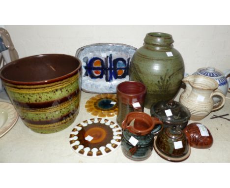 Two glazed circular teapot stands by Alan Wallwork; a shaped rectangular dish by Adam Dworski, Wye Pottery; a studio potter j