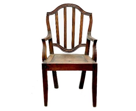 A late George III country made elm commode chair. With slat back, lift up seat and square legs.