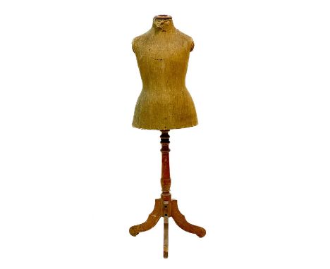 A mannequin or Taylor's dummy. Early 20th century, labelled for Wixley, Jones &amp; Co Ltd, London, raised on a birch pillar 