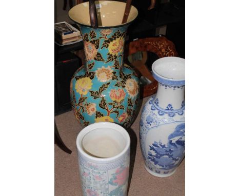 LARGE BALUSTER VASEin the Burmantofts manner; together with a blue and white baluster vase and a stick stand (3)