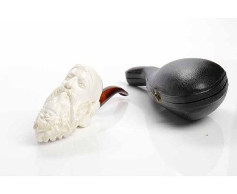 MODERN MEERSCHAUM PIPEthe bowl carved as a bearded Turk with feathered turban, with simulated tortoiseshell mouthpiece, 15cm 