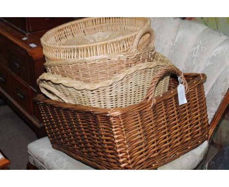 THREE LARGE VINTAGE LEATHER SUITCASEone in dark leather with embossed initial; together with a group of wicker baskets (8)