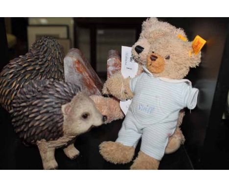 TWO MODERN STEIFF TEDDY BEARSeach bearing Steiff label; together with a pair of carved wooden hedgehogs and a pair of alabast