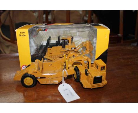 BOXED NORSCOT CAT DIIT TRACK-TYPE TRACTOR 55212together with a boxed Norscot Cat 980G Wheel Loader 55027, a Norscot Cat 631E 