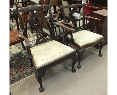 An 18th century mahogany Chippendale-style elbow chair of generous proportions, with foliate pierced splat back, drop-in seat