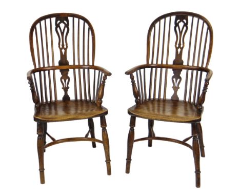PAIR 19TH CENTURY YEW, ELM & ASH HIGHBACK WINDSOR ARMCHAIRS, Nottinghamshire, circa 1830-1840, each with 'fleur-de-lys' frett