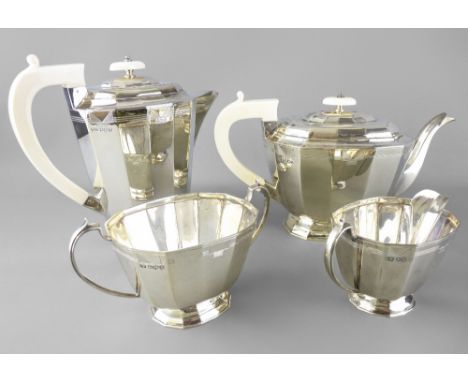 ART DECO FOUR-PIECE SILVER TEA SERVICE Sheffield 1939 and 1940 maker Emile Viner with ivory handles and lid knops, 51 Troy ou