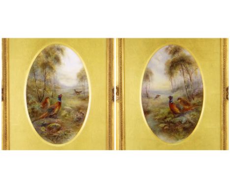 PAIR OF ROYAL WORCESTER JAMES STINTON DECORATED PLAQUES of oval form, opposing images of pheasants in woodland, Royal Worcest