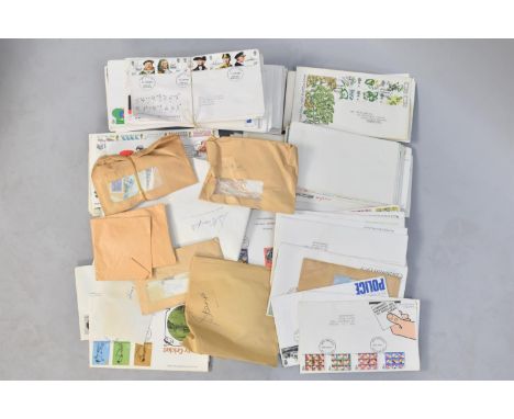 A Box Containing Various Loose First Day Covers and a Toy Squeeze Box Accordion 