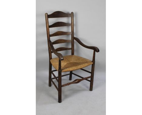 A Late 19th/Early 20th Century Oak Framed Ladder Back Armchair with Rush Seat 