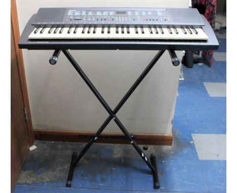 A Yamaha PSR 300 Keyboard With Adjustable Stand, Instruction Manual and Sheet Music and Books, Requiring Replacement Power Ca