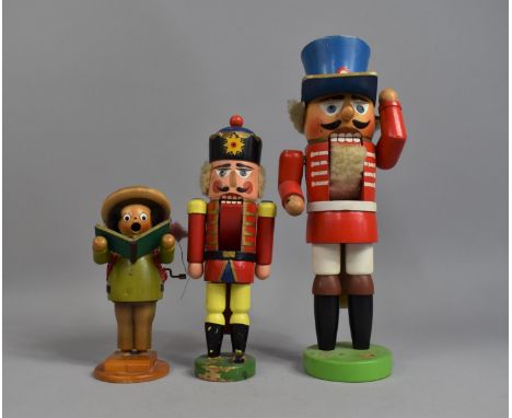A Collection of Three Painted Continental Wooden Figures, Two Soldier Nutcrackers and Musical Chorister, Tallest 34cms High 