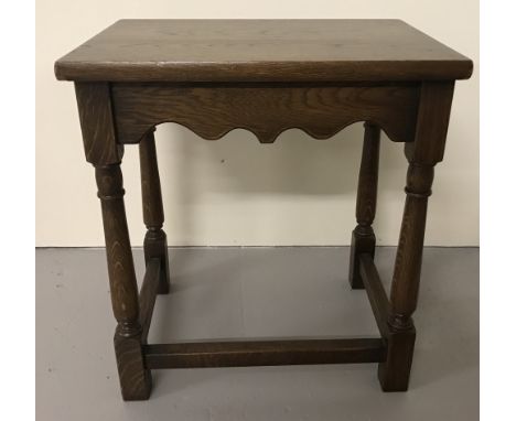 A vintage wooden side table with turned legs and scalloped detail.  Approx 41cm x 30cm x 45cm tall