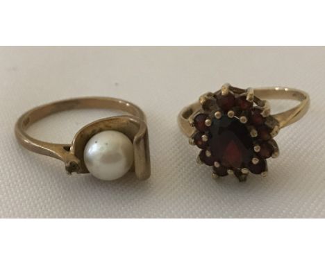 2 ladies 9ct gold dress rings. One set with garnets the other with a single pearl. Garnet ring has two small garnets missing.