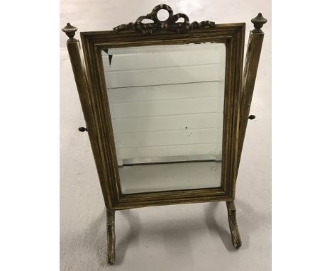 A Victorian wooden framed dressing table swing mirror painted gold. With bow design to top and metal acorn finials to sides. 