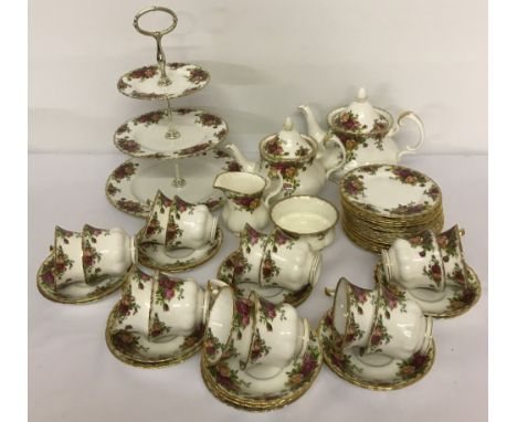 A collection of Royal Albert "Old Country Roses" tea ware. Comprising a teapot, water pot, 3 tier cake stand, milk jug, sugar