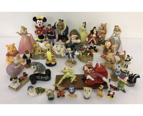A collection of ceramic Disney figures. To include characters from Beauty &amp; The Beast, Hunchback of Notre Dame,  Lion Kin