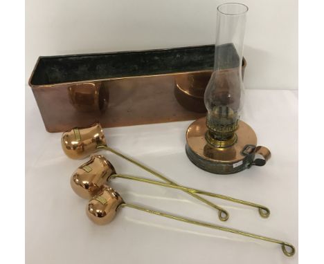 A collection of vintage copper ware items to include long planter. Together with 3 copper &amp; brass hanging measures labell