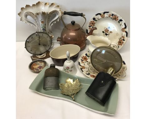 A box of mixed items to include hip flasks, copper kettle, ceramics and vintage clocks.  