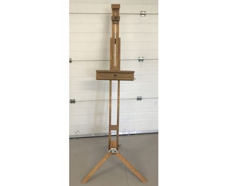 A large light wood artist easel.  Approx height fully extended 191cm.