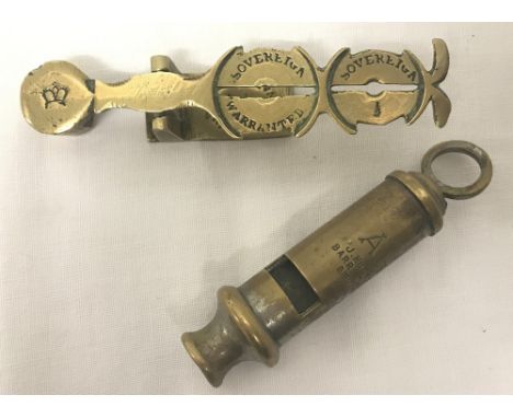 A set of vintage brass sovereign weighing scales with stamped crown mark to end. Together with a A.R.P. whistle. 