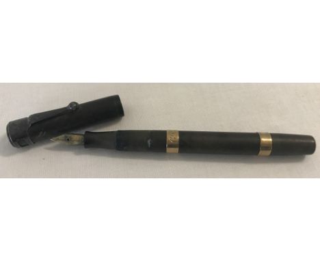 A vintage Waterman's Ideal No 52 green fountain pen with 9ct gold banding. Hallmarked London 1933 with FDW makers mark to bot