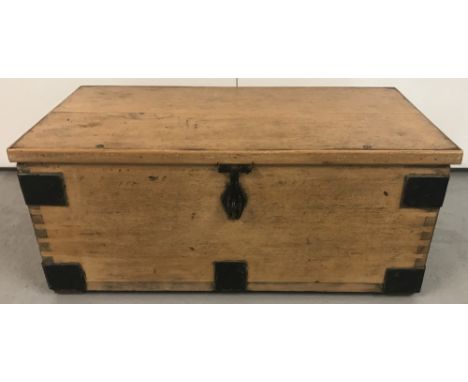 A vintage pine 2 handled blanket box with metal banding and drop down handles. Painted interior. Approx. 26cm tall x 63cm wid