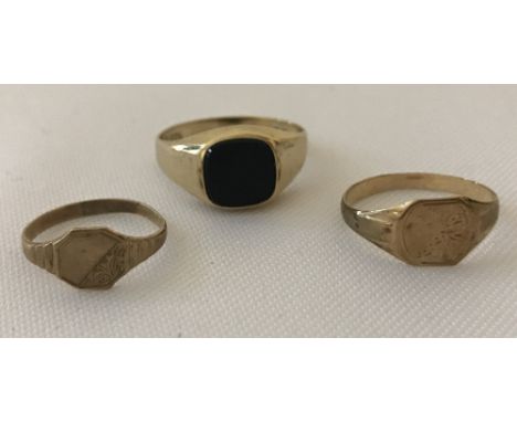 3 children's 9ct gold signet rings. Two with half engraved detail to front and one set with onyx. Sizes D, L and H1/2. Being 